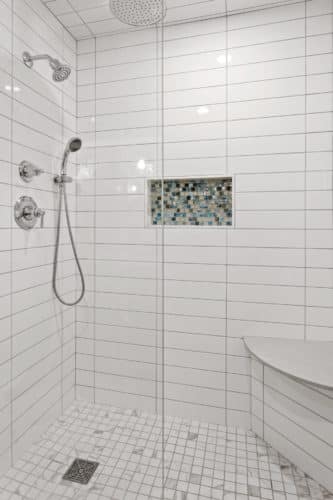 Master shower niche with accent tile