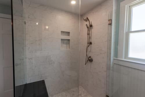 Shower tile with double storage niche